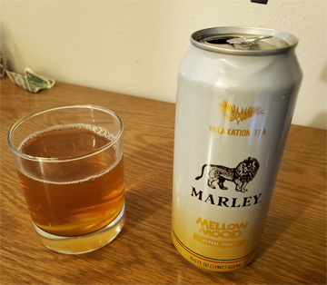 A can of marley mellow tea and some of it poured in a rocks glass. It's a very mellow picture